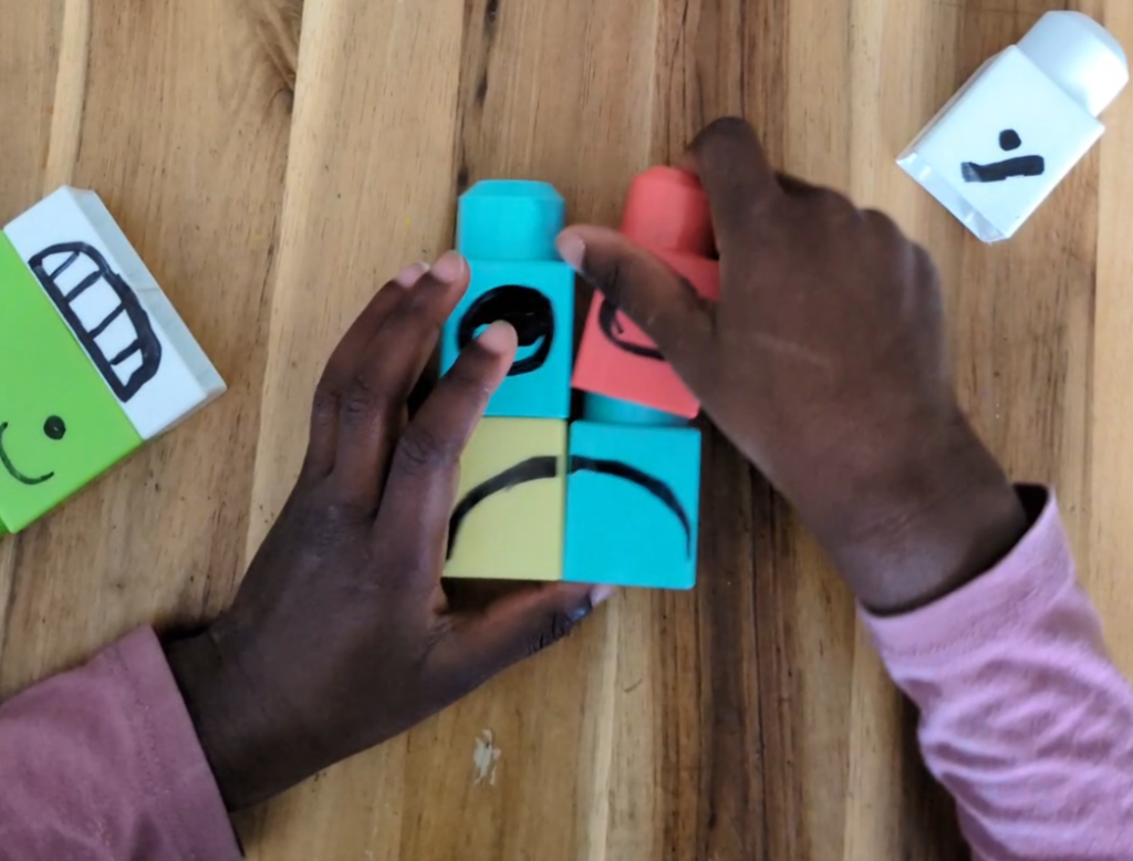 educational toys for toddlers. A child building emotions with mega bloks