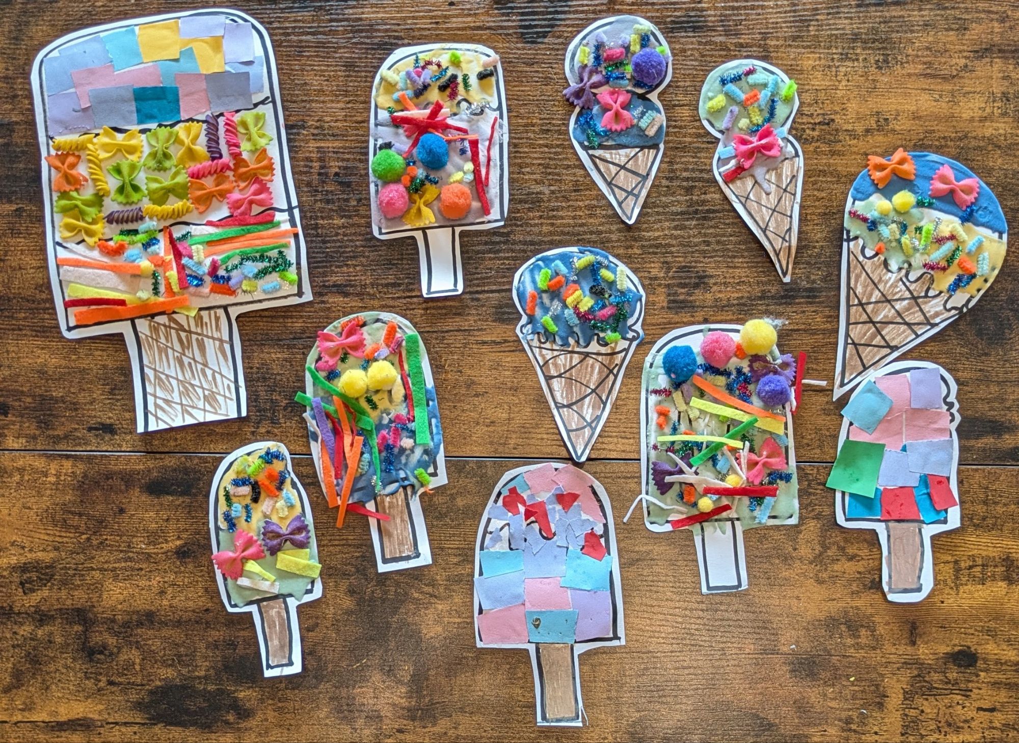 A flatlay image of mixed media popsicle ice craft for kids