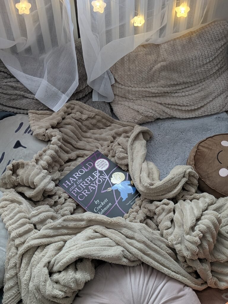 Expat mom reading a picture book aloud to her three girls on the living room floor of a small flat.